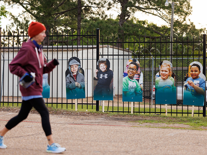 Signs featuring Children's of Mississippi patients reminded runners of the purpose of Run the Rainbow.